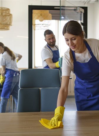 Three people providing professional cleaning services