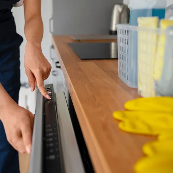 Close-up of a person cleaning an oven
