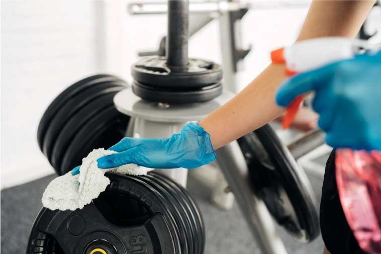 Cleaning weight plates in a gym