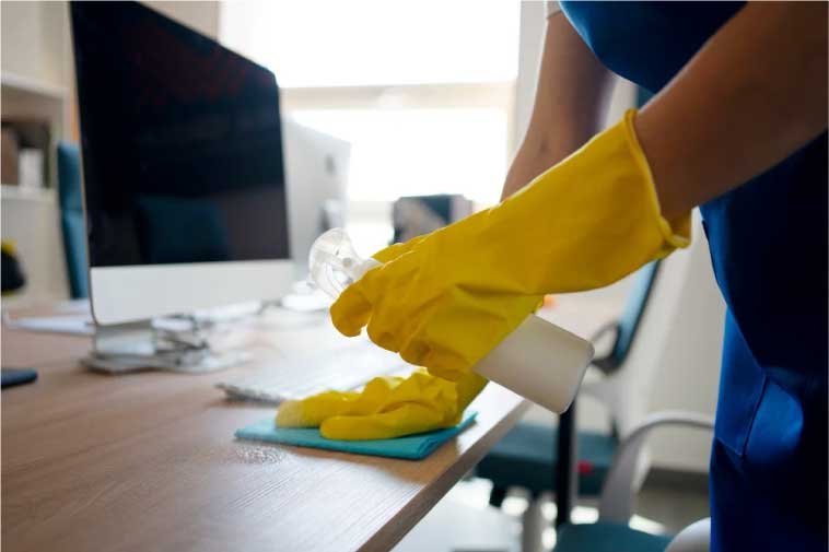 Close-up of a person performing an office cleaning service